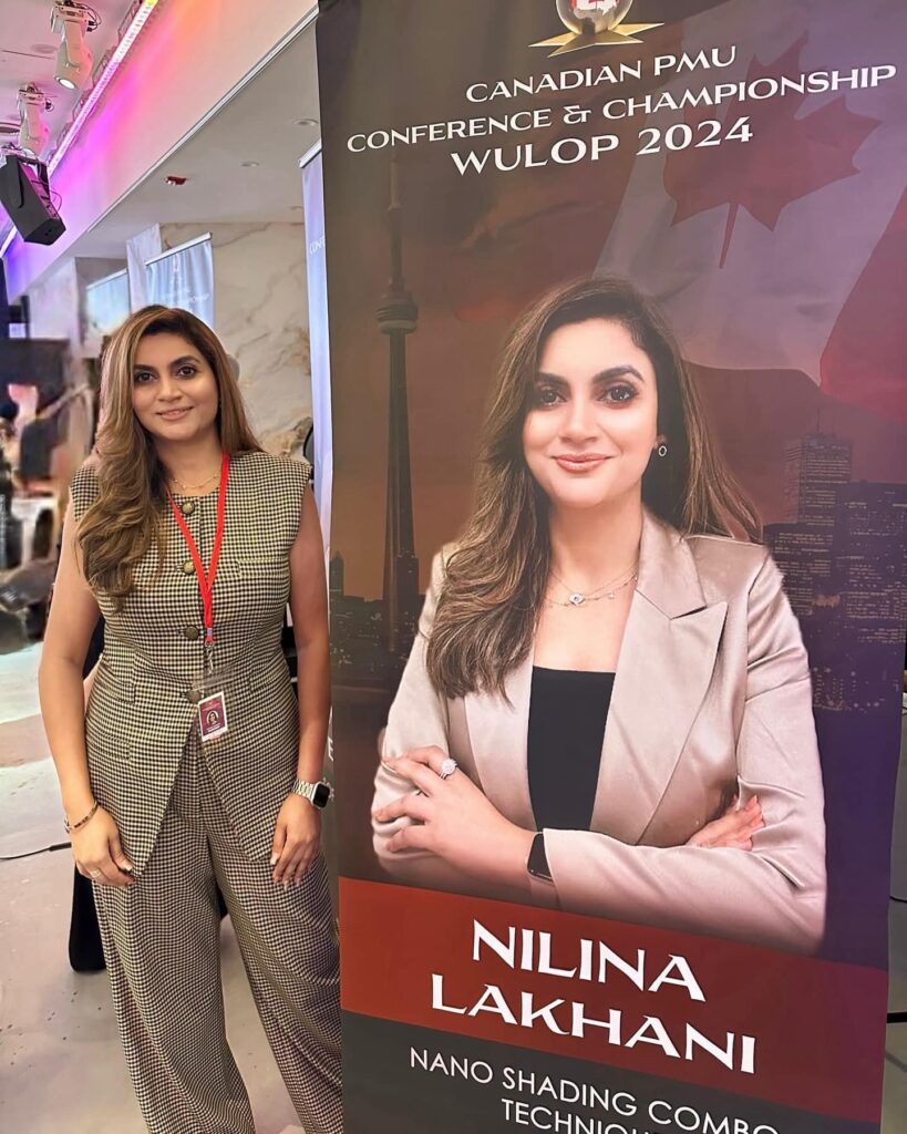 photo of Nilina Lakhani next to a poster with her photo